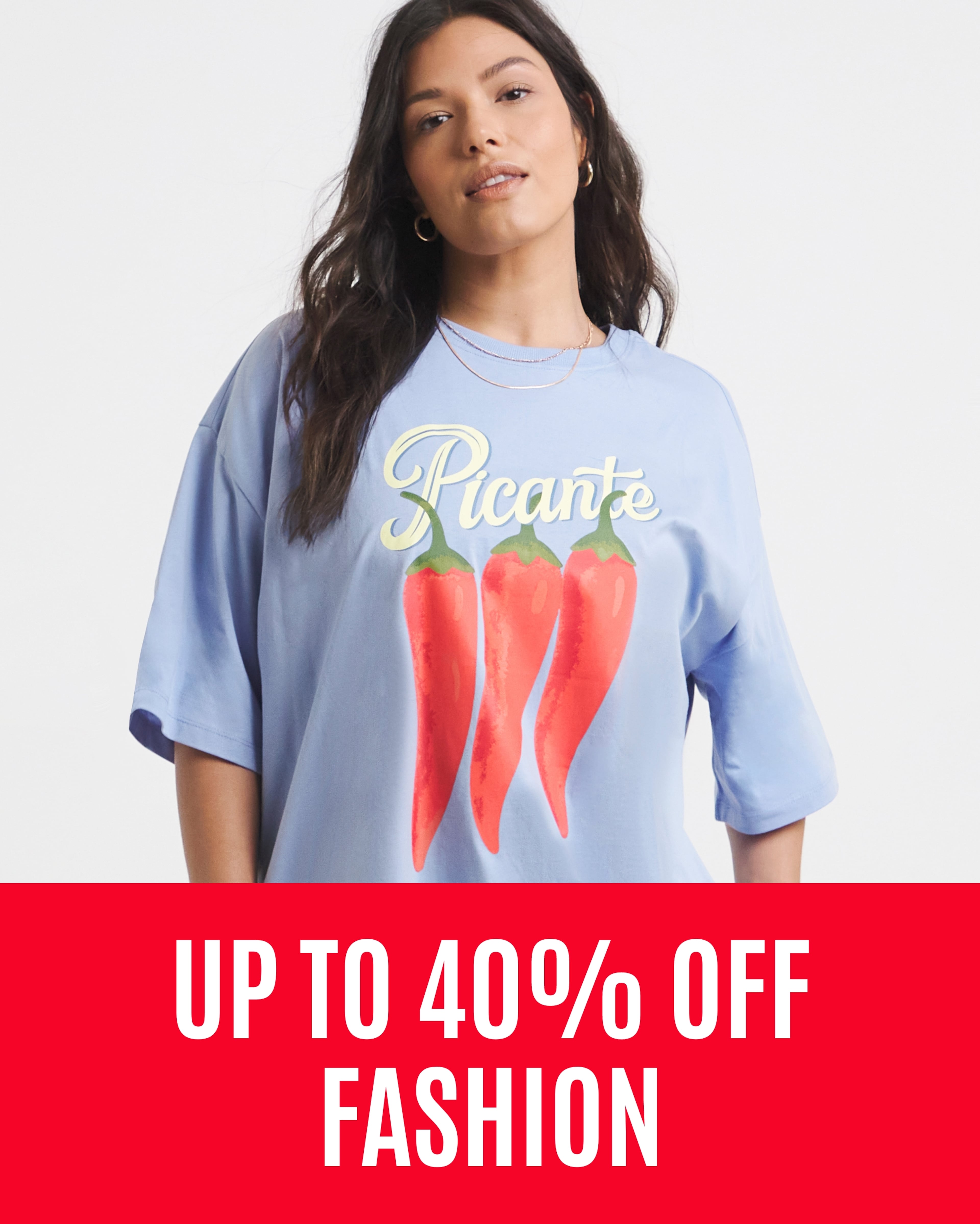 Model wearing a blue oversized graphic t-shirt with a sale message overlaid.