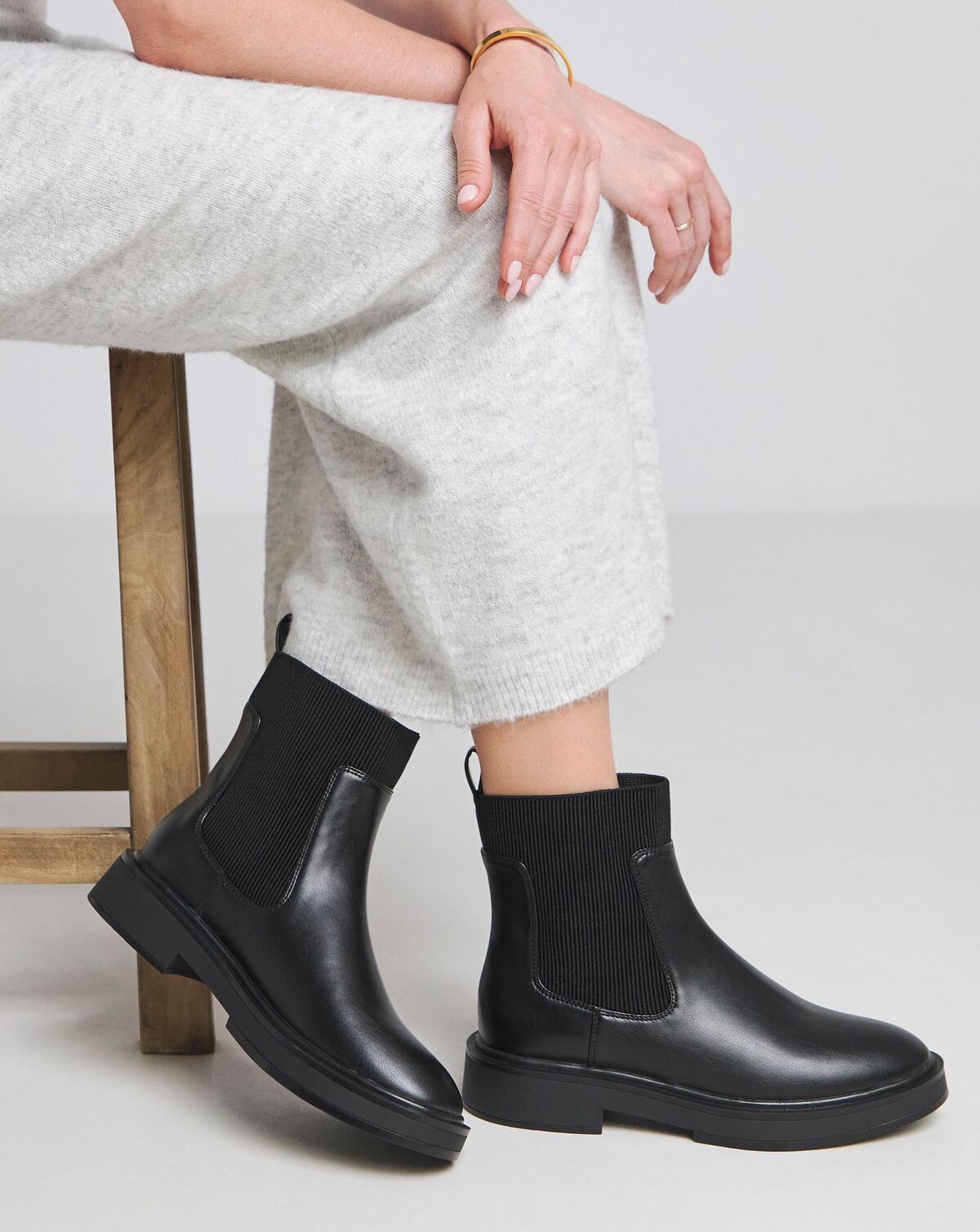 A pair of black ankle length Chelsea boots