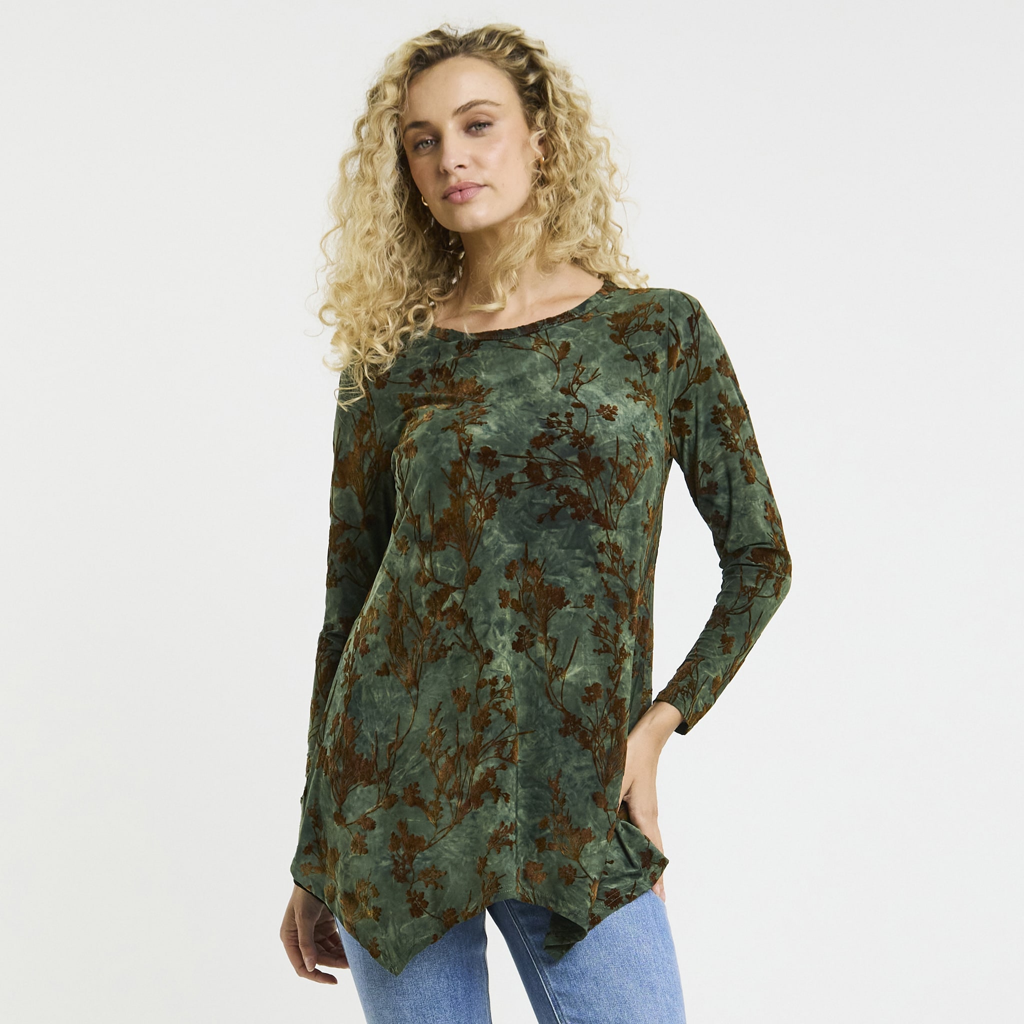 A lady wearing a green long sleeved tunic