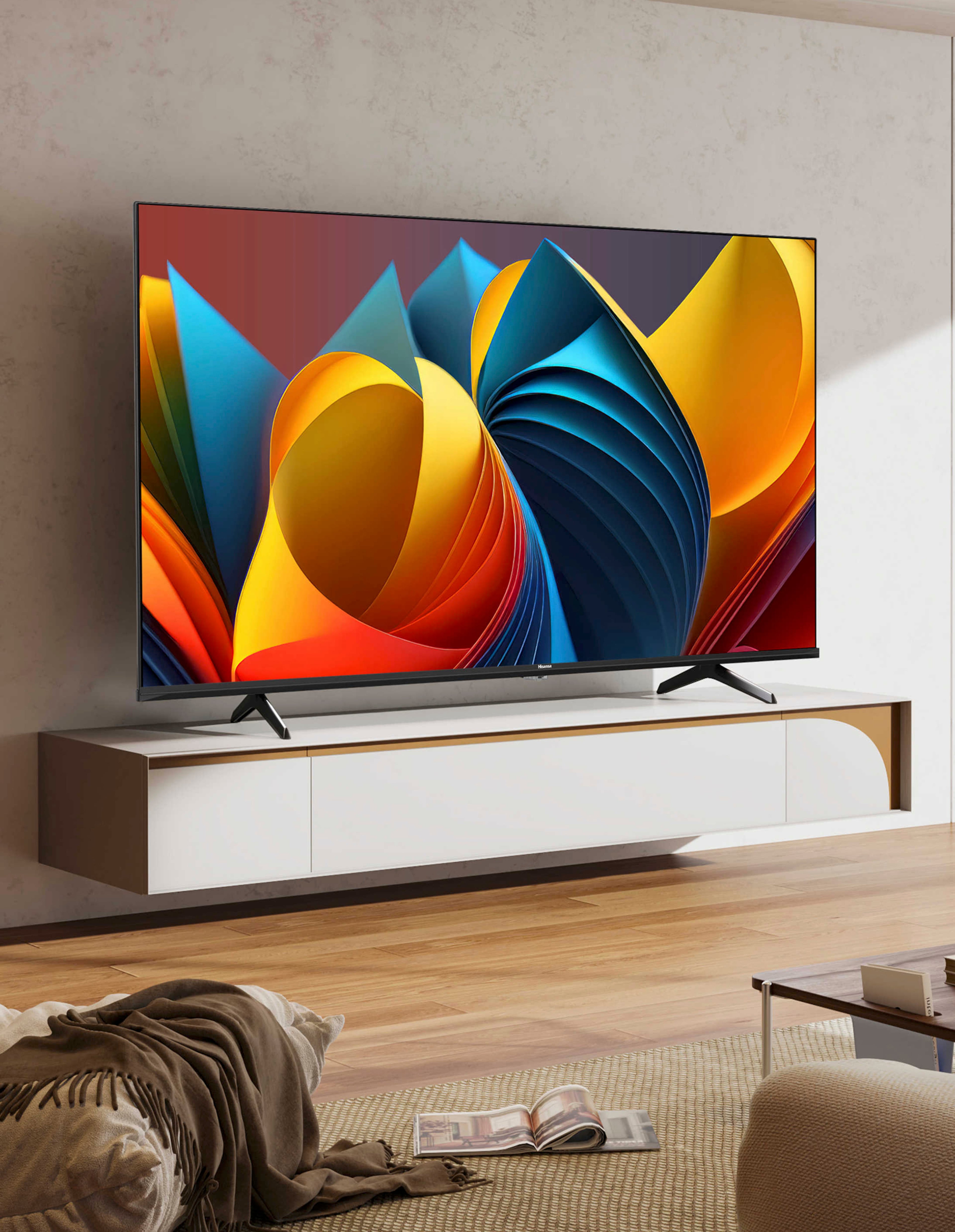 A large TV on a sideboard
