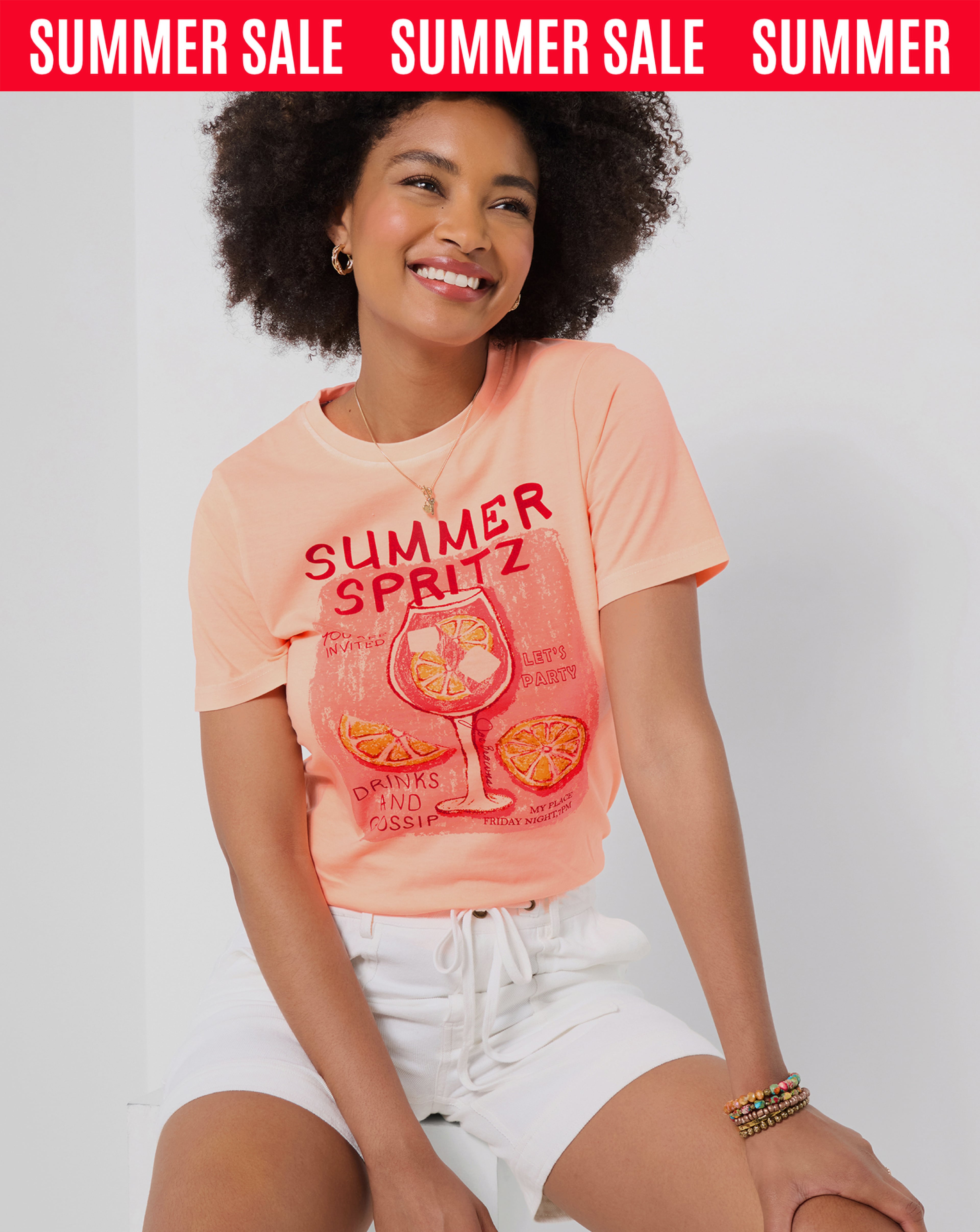 Summer sale banner featuring a person wearing a Joe Browns graphic t-shirt with white shorts.
