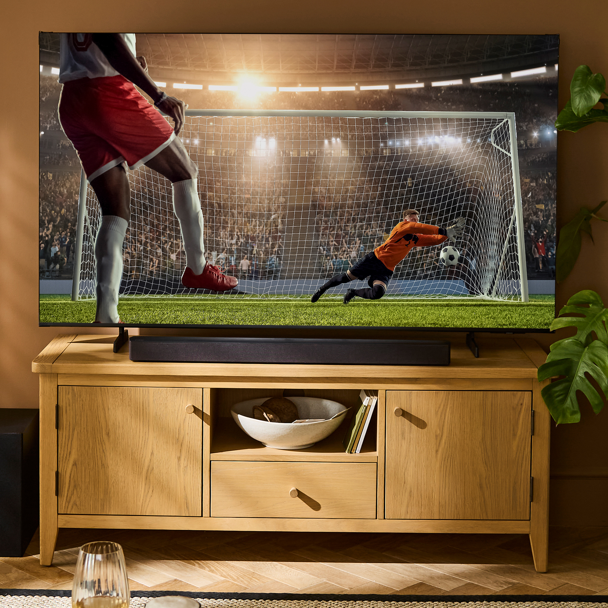 TV with football game is pictured.