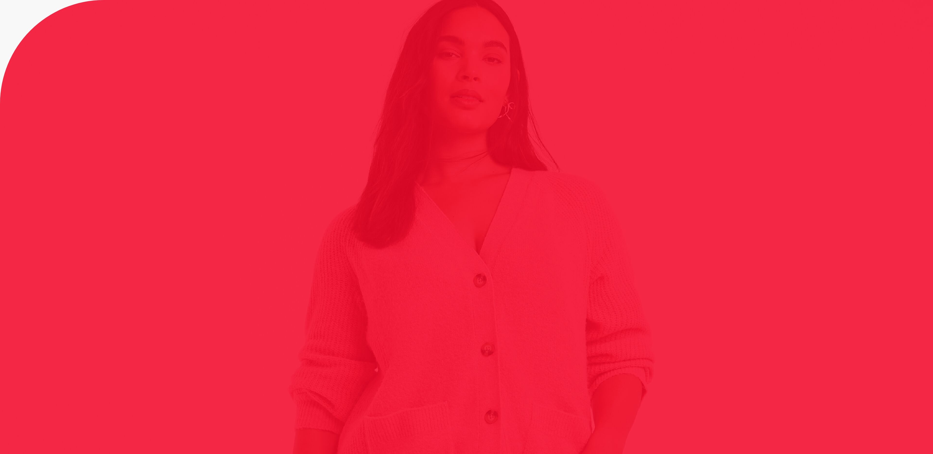 A model wearing a pink boyfriend cardigan and blue jeans, with a red-coloured overlay.