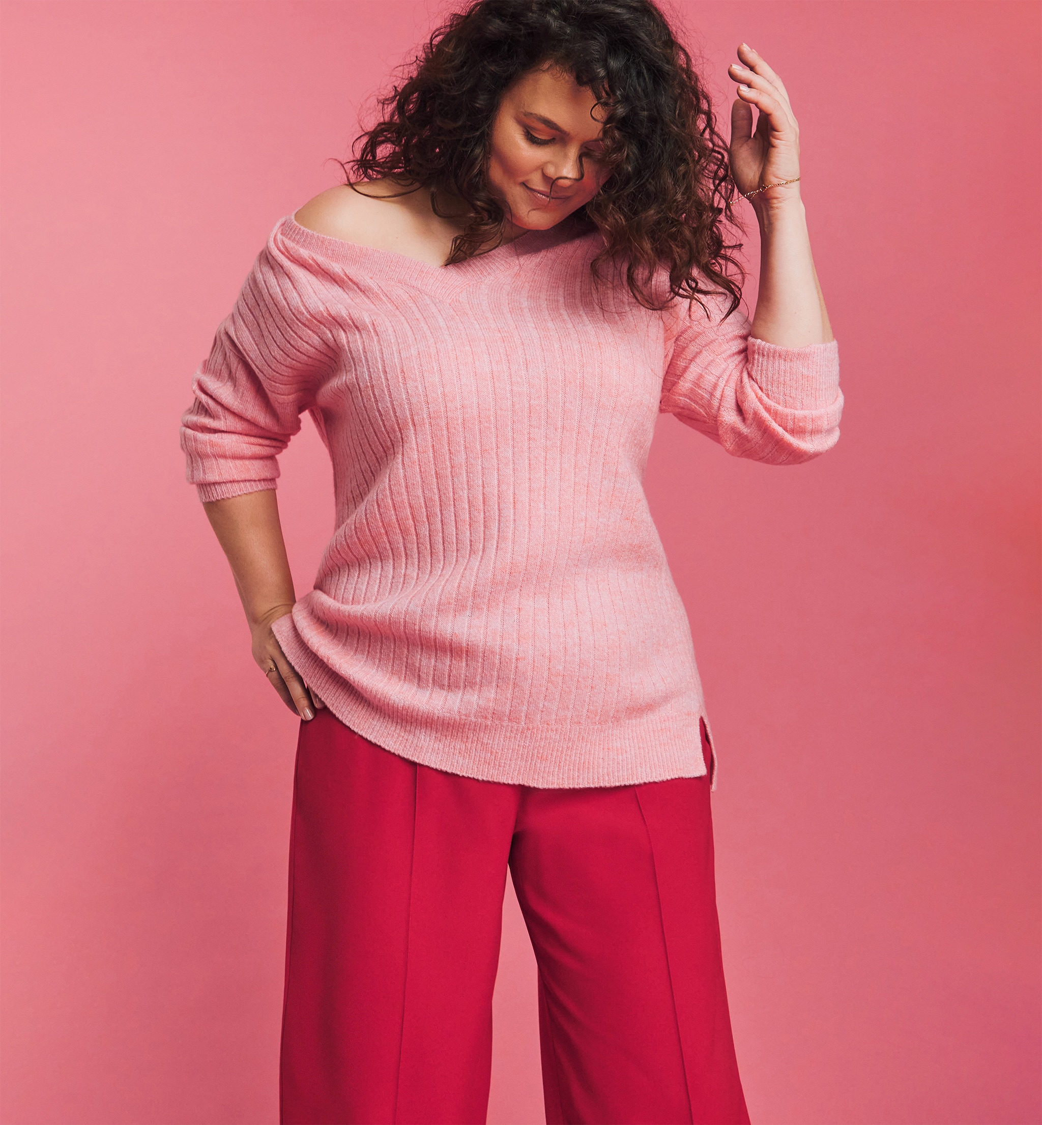 A woman wearing pink and cerise pyjamas