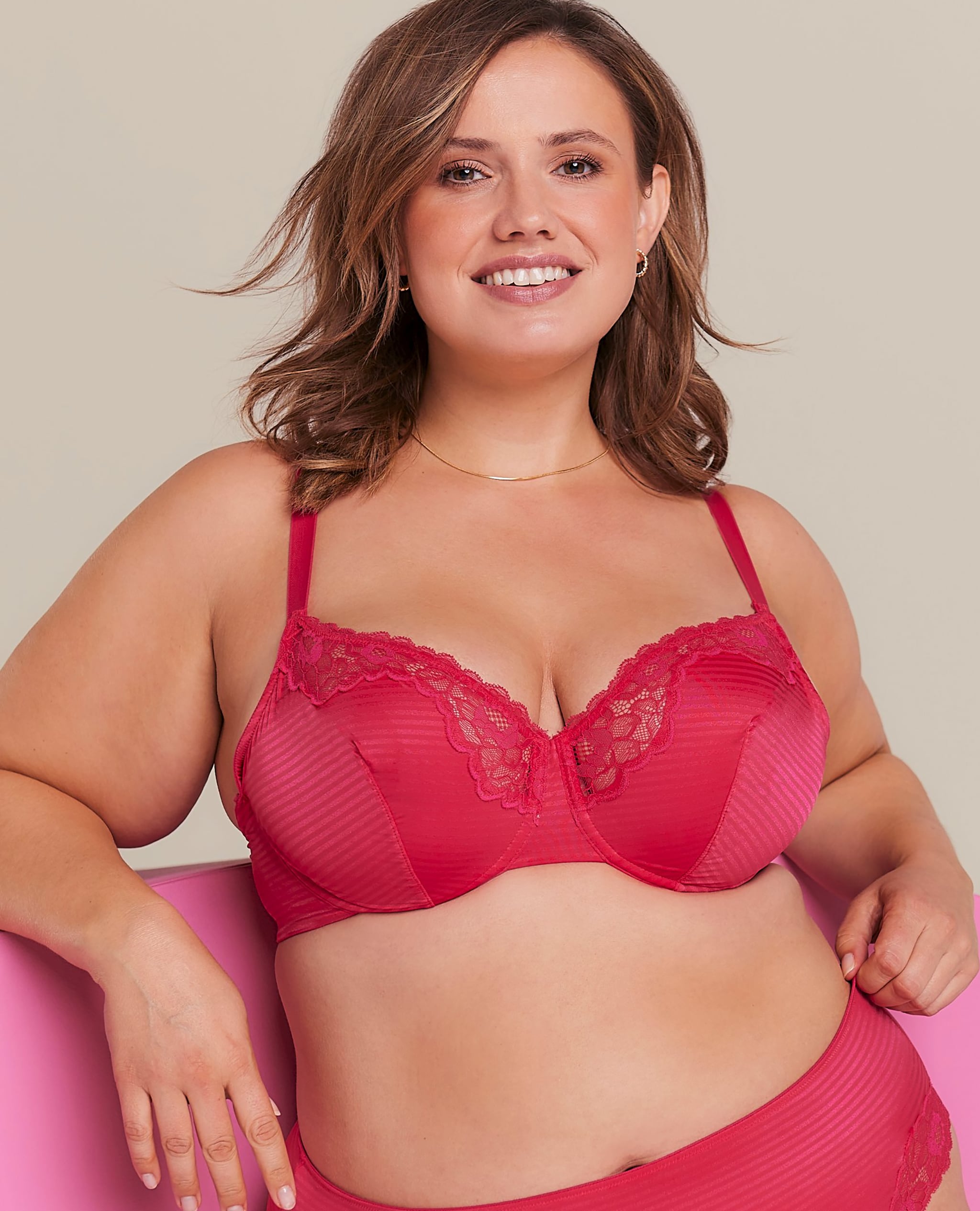 A woman wearing pink balcony bra