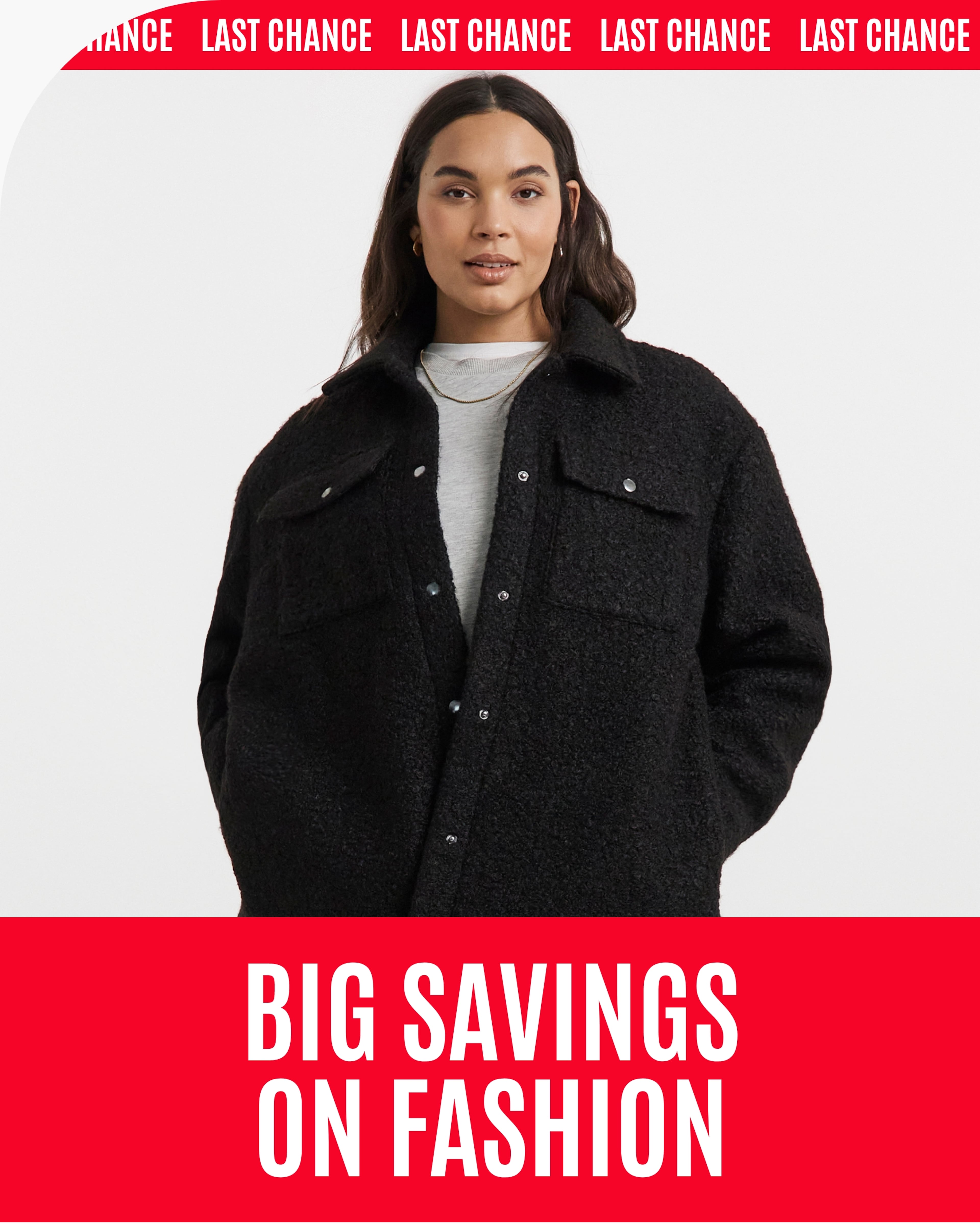 A person wearing a black textured button-up jacket over a light grey top.