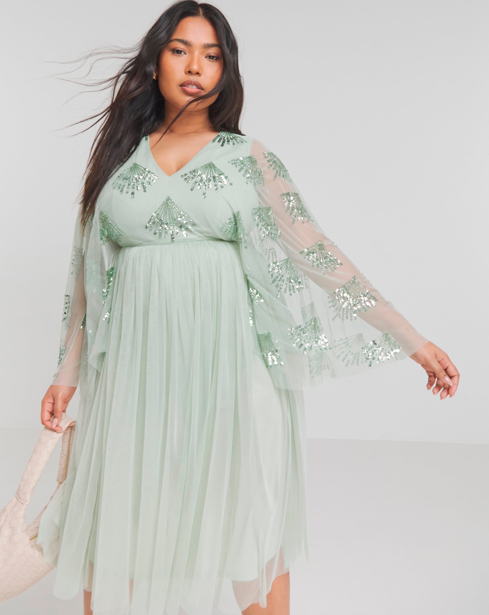 Model wearing sage green Maya Curve Cape Sleeve Embellished Midi Dress
