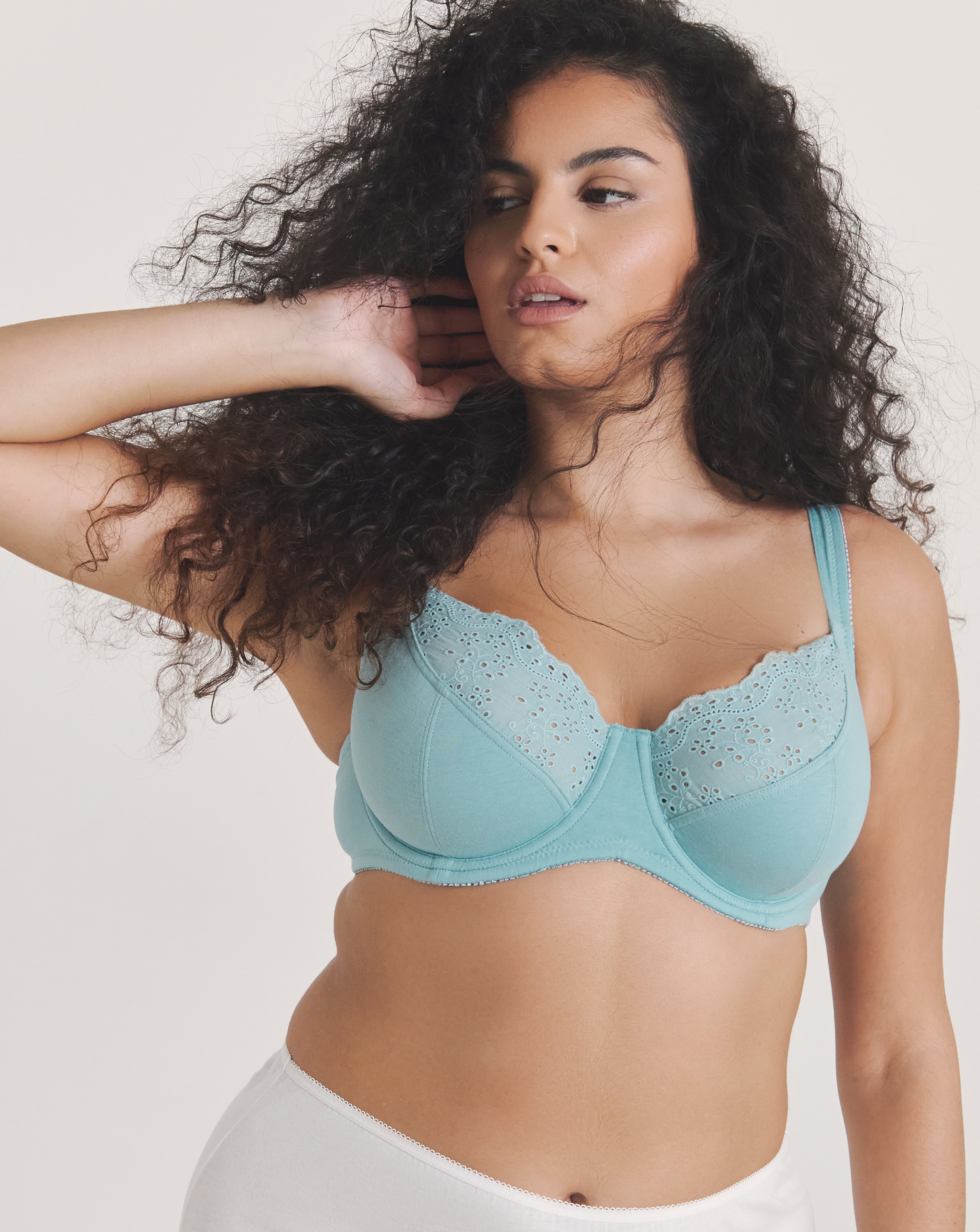 A person wearing a blue Pretty Secrets wired full cup bra.