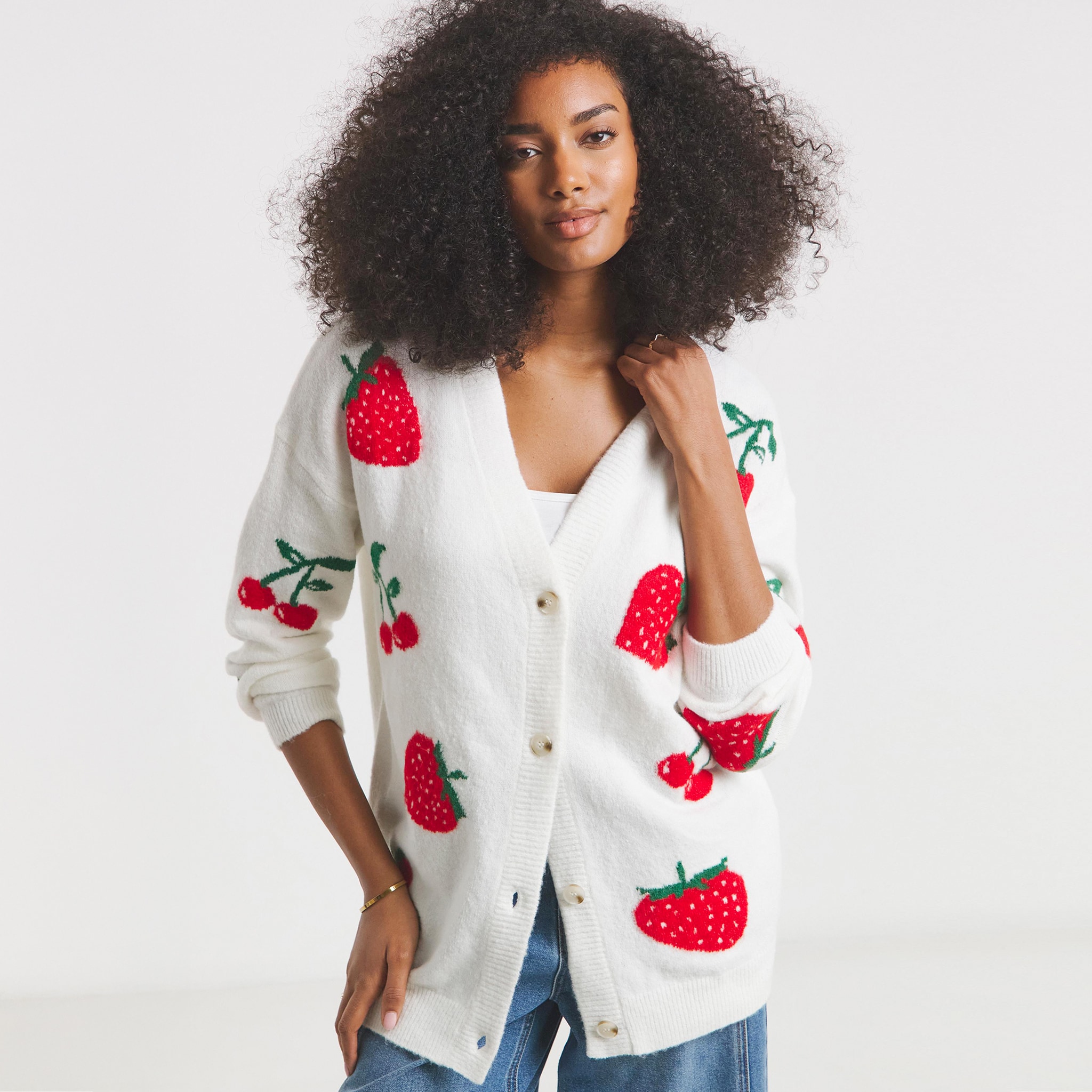 Woman in white cardigan withe strawberries